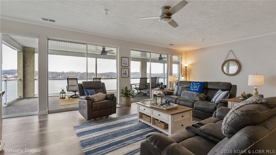 Luxury lake living at West Palms on the Lake culminates here, welcoming you to the top! This meticulously maintained, top floor  condominium offers breathtaking, unobstructed lake views from an expansive deck, providing an ideal blend of comfort and convenience. The open-concept layout features nine-foot ceilings, luxury vinyl plank flooring, and a spacious living room and oversized sliding doors leading to a large deck with sleek glass railings, ensuring unobstructed, sweeping panoramic lake views! Enjoy three private en-suite bedrooms, plus a stylish half bath. The modern kitchen boasts solid surface counters and stainless appliances, flowing seamlessly into a generous dining area. A dedicated laundry room adds everyday ease for full time or 2nd home living. Community amenities include a lakefront pool, clubhouse, fitness center, boat trailer parking, and docks. CO-MO Connect internet and elevator access add extra convenience. A 12x32 boat slip & a covered PWC slip are included. Situated in an ideal location, close to numerous waterfront attractions by water! This represents lakefront living at its finest!  Garage available for additional money.