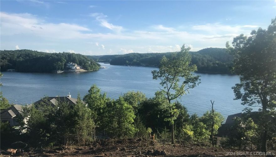 Introducing an exciting new lake access residential development with great views of Linn Creek Cove!  12' by 36' foot boat slips available in community dock at additional charge.  Access via tram or steps and nearby load/unload platform.  Unwind and socialize at the community pool. Central sewer and community water. This is a prime opportunity to be part of a quiet and convenient lake access community with lake views.