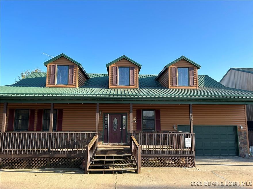 Unique investment property, in the Camdenton School District, that can be used as an owner occupied home with adjacent heated commercial shop and rental community with storage units. 

One large single family home, two ensuite masters, with two car garage, clean 10 unit mobile home community and 16 self storage units. 7 of the 10 mobile homes have been recently remodeled to modern style. 

16 Self-Storage Units. Rates average $125/mo per unit. 
10 Mobile homes, each rented for 800/mo
3,000' heated commercial shop rented for $1,225/mo
Large single family home, rented for $1,250/mo  

Property can be divided.