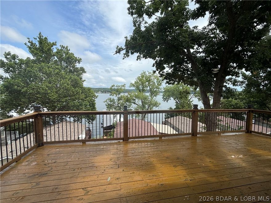 This remodeled lake-home is the total lake package with an unbeatable price tag! Come check out the big lake views from this totally remodeled 3 bed, 2 bath home in the Oklaterre lake community. Inside you will find vaulted ceilings, luxury vinyl plank flooring, new paint, remodeled kitchen (new appliances), butcher block island facing the lake, double sliders to enhance your lake view, LED lighting throughout, washer/dryer, and a large master suite compete with tiled shower in the bathroom. Outside you will find large deck with big views of the Gravois Arm, and a large carport to protect your vehicle. The Oklaterre community also offers an array of amenities to enhance the lake-life experience. Just a short walk or golf cart ride away you will find the community docks (Rentals slips usually available), boat ramp, large lakeside martini deck, boat trailer parking, extra guest parking, walking paths, and greenspace for pets. If this isn't enough, the community even has garages/storage units available to keep all your lake toys under roof! Properties that offer this much value are rare! Schedule your showing today and make your dream of lake living a reality!