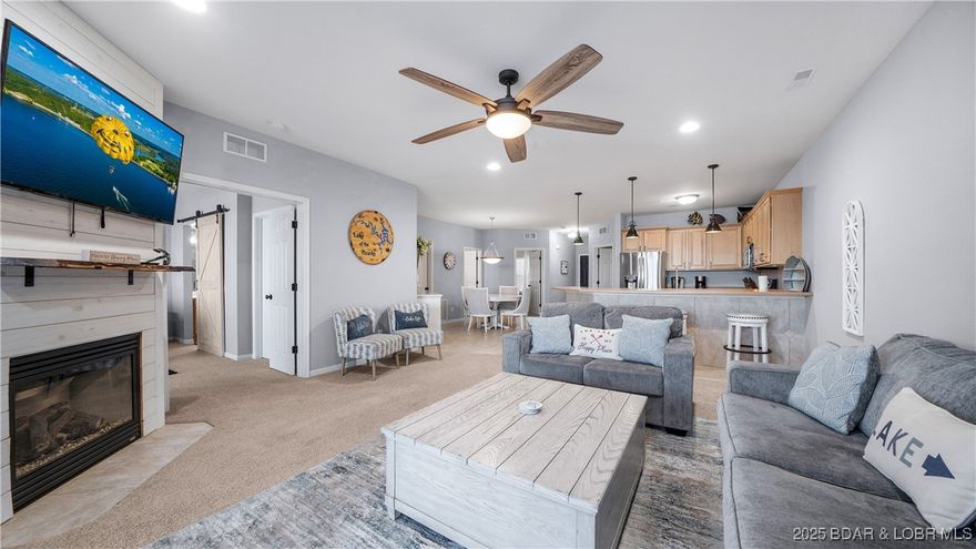 Welcome to Lands End Unit 113, a beautifully updated 3-bedroom, 2-bath condo offering one of the best main channel views at Lake of the Ozarks! Updated in 2024, this stylish unit features modern finishes, open-concept living, and a bright, inviting layout designed for comfort and entertaining. The spacious kitchen flows seamlessly into the living area and out to a private lakeside deck where you can relax and take in the breathtaking views. Thoughtful details like blackout curtains in the master bedroom and living room add comfort and privacy. This condo also includes a massive 14x48 boat slip, perfect for larger boats and enjoying everything lake life has to offer. Whether you’re seeking a full-time home, weekend getaway, or rental investment, this property checks every box. The Lands End community is known for its resort-style amenities, including multiple pools, a playground, and a clubhouse. Conveniently located close by both land and water to the exciting new Oasis Amusement Park, top restaurants, and shopping, this property offers the perfect blend of luxury, location, and lifestyle.