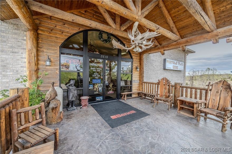 Incredible Commercial Opportunity in Prime Osage Beach Location. Upon purchase buyer will receive rights to 31 year old business name. Don’t miss this rare chance to own a 15,000 sq ft commercial building and 8 unit strip mall building in one of the highest-traffic areas. This property offers endless potential & is currently outfitted for firearm and archery retail—but with its flexible layout, it’s perfect for a wide range of business ventures. The main level impresses with 21-foot vaulted ceilings finished in Colorado pine, a stunning floor-to-ceiling stone gas fireplace, a spacious L-shaped service desk, office space, custom gun cases, and a dedicated gun museum. Downstairs features archery shop with large windows, a serene water feature, and a fully equipped service and repair desk. This level also features a professional indoor shooting range with six 50-foot lanes & lounge-style seating and viewing area. Whether you want to continue in retail, expand into multiple businesses, or reimagine the space entirely, the possibilities are endless. Ample parking is available to accommodate your future customers with ease. Call today to learn more about this exceptional opportunity.