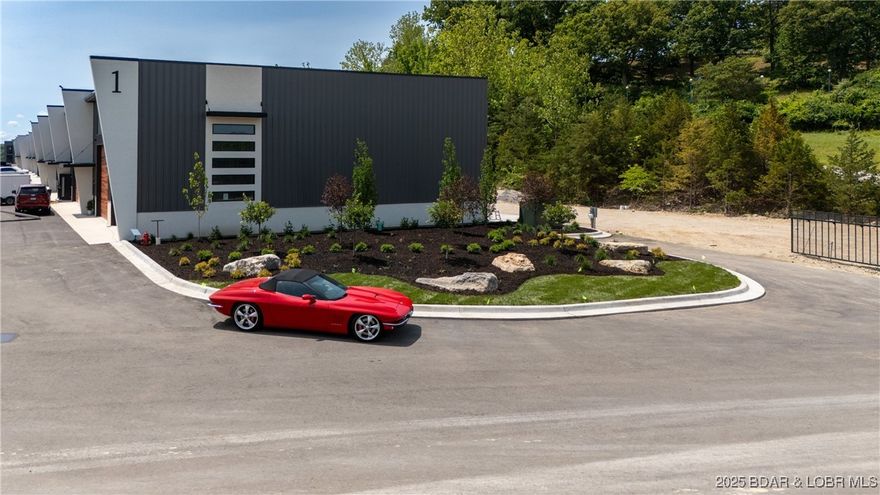 The Toy Box is located at the Lake of the Ozarks most recognized intersection at Horseshoe Bend and Bagnell Dam Blvd. in Lake Ozark, Missouri. With a 180 degree Panoramic View of Lake of the Ozarks, these Lux Loft units are like nothing else in the area. Each unit is (25’ x 60’ with 23’ side walls and a mezzanine) for Residential use only. The development will be governed by a Condo Owner Association and will include a pool, clubhouse with full indoor kitchen, innovative gym, outdoor grilling area and pickle-ball courts. A boat wash area and RV pump out allow you to work and play within your own community. An observation deck with fire pit overlooking miles of Lake of the Ozarks shoreline truly set this property apart from all others, while giving you the peace of mind of a gated community! All of this just a minute drive from the buzzing Bagnell Dam Strip. Come be a part of the Lake of the Ozarks where We Have a Lifestyle For You!