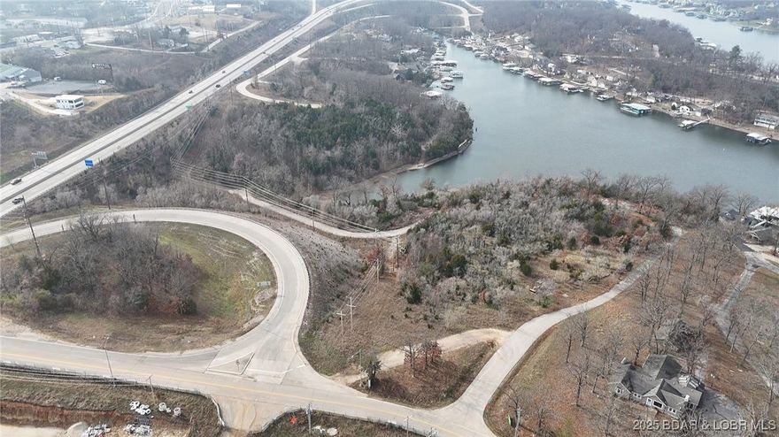 Exclusive Lake Ozark Waterfront Development Opportunity!! Experience one of the last great pieces of prime shoreline real estate on Lake of the Ozarks. 8.5 +/- acres of pristine waterfront, this property offers endless potential for a luxury resort, marina, or private estate enclave. Situated along prestigious Jeffries Street, these commercial and waterfront lots combine elite accessibility with breathtaking panoramic views. Highlights of property include: Gently sloping terrain ideal for luxury builds, exceptional water frontage and sunset exposure and rare large acre offering in the heart of Lake of Ozarks. All utilities nearby and easy highway access. Will divide.