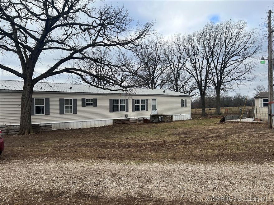 This 60-acre farm is fully fenced and cross-fenced with cattle currently on fields. It features four wells providing dependable water throughout the farm, along with a Ritchie automatic waterer to keep livestock supplied year-round.
With gently rolling ground and pasture, this farm is ideal for cattle or horses. The 3 bdrm 2 bath manufactured home sits on a permanent foundation. Has other outbuildings for storage as well as a 2 car detached garage and a gated entrance. Back of property  was used at one time as a landfill. It has open pasture as well as wooded area so best of both worlds. Many opportunities with this one .
