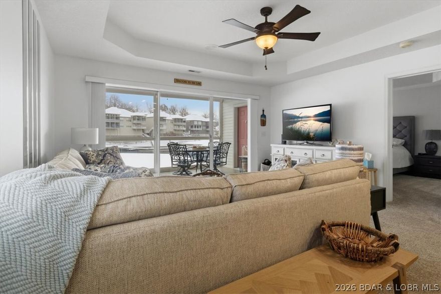 Lakefront living in Lake Ozark, MO in the desirable Charleston Condominium community—this inviting 3-bedroom, 3-bath condo is your chance to enjoy the best of the lake lifestyle. From the moment you walk in, the open floor plan welcomes you with natural light and easy flow, perfect for relaxing weekends or hosting friends. Best of all, it comes turn-key, so you can start enjoying it right away. Step out onto the screened-in deck and take in peaceful water views—your morning coffee and evening sunsets just got an upgrade. With 1,385 square feet, there’s space for everyone to unwind after a day on the water. The 10x30 boat slip with hoist is included and just steps from your door, making lake days effortless and spontaneous. You’re also minutes from local dining, shopping, and golf, so every day offers something new to enjoy. Whether you're looking for a weekend escape or a place to gather and make lasting memories, this condo makes it easy to say yes to lake life. Schedule your private showing today—opportunities like this don’t last long!