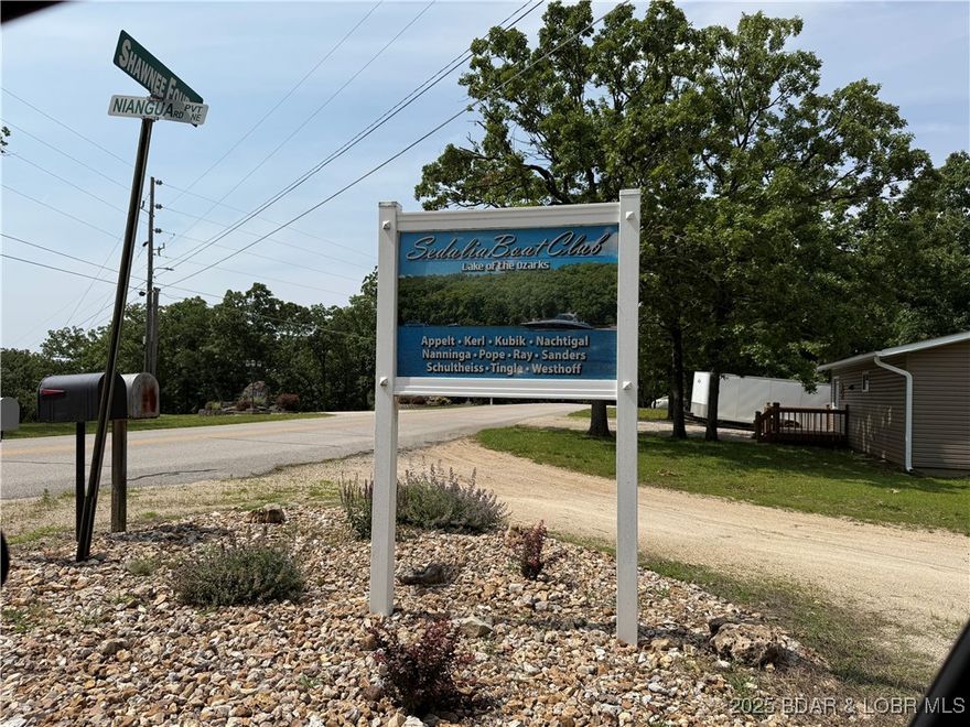 Dreaming of a Lakeside Retreat? This vacant land in Sedalia Boat Club Subdivision boasts stunning lake views and access that will inspire your imagination. There is enough space to build your dream retreat. Enjoy hassle-free lake living with a dock,  hoist up to 4500 lbs., ensuring your water adventures are just a walk away. Now has 200 Amp Hook up!!! Enjoy being close to Lake House 13, Frankie & Louie's, Sunrise Beach Safari, Shrimp Daddy's and Don Chilios. Build your Lakeside Dream Home!! HOA Fees are $476 annually which includes, dock, shelter house, bath house and a Launching Ramp. This Property also has an Ameren-approved dock permit. Come check out the View!!!