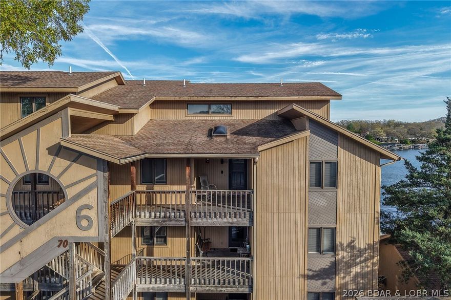 Beautiful Lake Views in this sought after well established complex located on the Osage 10m.m. at Lake of The Ozarks. This top floor end unit comes with a 16x40 dock slip right in front of this unit and (2) single car garages straight across from unit. 3 bdrms all have attached full baths and 2 bdrms have 2 large walk in closets each. 4th bdrm is small with no closet and would also make a great office. Amenities include a large clubhouse with hot tub, sauna's, workout room, game room, outdoor pool, tennis/pickleball court, storm shelter and boat ramp. Great location by land and water for all your activities just a short distance off Hwy.5