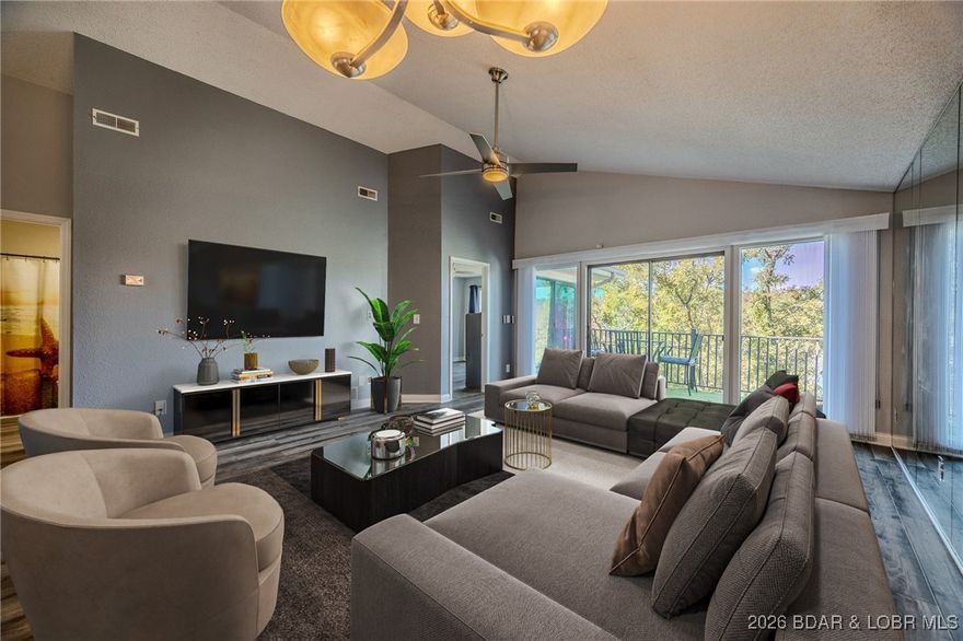 Wake up to panoramic water views and effortless lake living in this beautifully remodeled 2BR/2BA condo in Jonathan’s Landing at the 3MM. Vaulted ceilings and floor-to-ceiling windows fill the space with natural light, showcasing both main channel and cove views from the living area and primary suite.

The updated kitchen features granite countertops, stainless appliances, a commercial-grade refrigerator/freezer, and modern lighting—ideal for entertaining or everyday ease. The primary suite offers a spa-like feel with a zero-entry shower, ambient lighting, and a touchscreen mirror.

Quality upgrades include luxury vinyl flooring, fresh paint, new trim/doors, 2022 HVAC, smart thermostat, Moen Flo water system, keypad entry, and a motorized awning with LED lighting.

Offered partially furnished with stacked washer/dryer. Includes a 10’x24’ covered slip with deck box for easy lake access.

Minutes to Shady Gators, Baxter’s, JB Hooks, and the Strip, plus golf, shopping, and groceries nearby—move-in ready and perfectly positioned to enjoy the best of Lake of the Ozarks living.