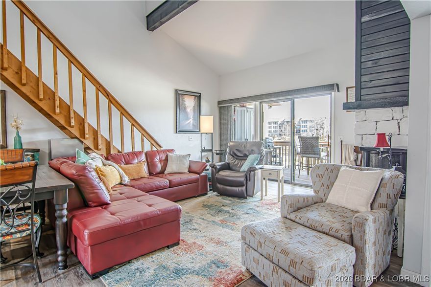 Are you looking for an Awesome weekend getaway or full-time living lakefront property?  Well here it is!!!  This fantastic condo is in a cove location with a main channel view from the deck.   It has the Master and guest bedrooms on the main level with two updated bathrooms. Kitchen is open to the living room for a spacious living area. When you have guests or your children want their own space this unit is perfect.  It has a large loft area with a separate bedroom and full bathroom and walkin closet.  The complex offers two pools, one main channel and one in the cove, tennis, playground and clubhouse.  You can see and shout to the included boat slip and lift from the deck.  The location is great by land or water.