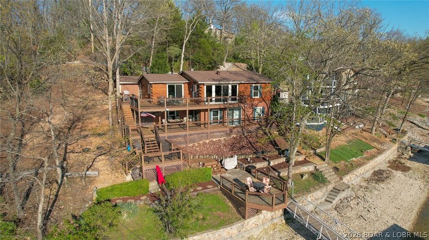 A Horseshoe Bend GEM!! Rarely do you find this much home in this GREAT of condition, with deep water, unencumbered dock profile, and this phenomenal of a location! With over 2,000 square foot, 4 bedrooms, 2 bathrooms, & multiple indoor & outdoor entertaining spaces, theres not much more you can ask for! Located in a large, deep water cove, you are just an idle away from lakefront restaurants, protected waters for tubing & water sports, & the main channel. Located just a short drive down Duckhead, you can experience the convenience of Highway HH without the traffic. Just minutes away from shopping, dining, grocery stores, and the highway, it is quite literally one of the best locations you can ask for. Located on the end of the street with a vacant lot next door, you don't have to sacrifice your privacy with this location. This home can also double as a great short-term rental investment opportunity with the ability to nightly rent within the subdivision. With great location and space for all of your guests, this home will not disappoint! Do not wait- get in the car, drive down, and come look at your new dream home!