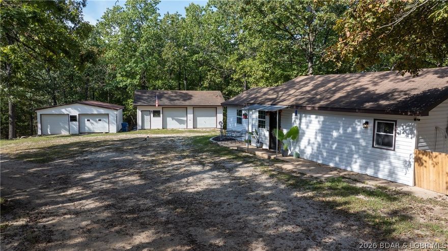 Charming 2-bedroom, 1.5-bath home on 3.8 acres in the sought-after Camdenton School District! Offering 1128 sq ft of comfortable living space, this property includes two detached 2-car garages—perfect for vehicles, hobbies, or storage. Enjoy the peace of country living just minutes from Highway 54 and all Camdenton amenities. The home features a private well and septic system, providing convenience and low utility costs. A great opportunity for a starter home, weekend getaway, or investment property near Lake of the Ozarks!