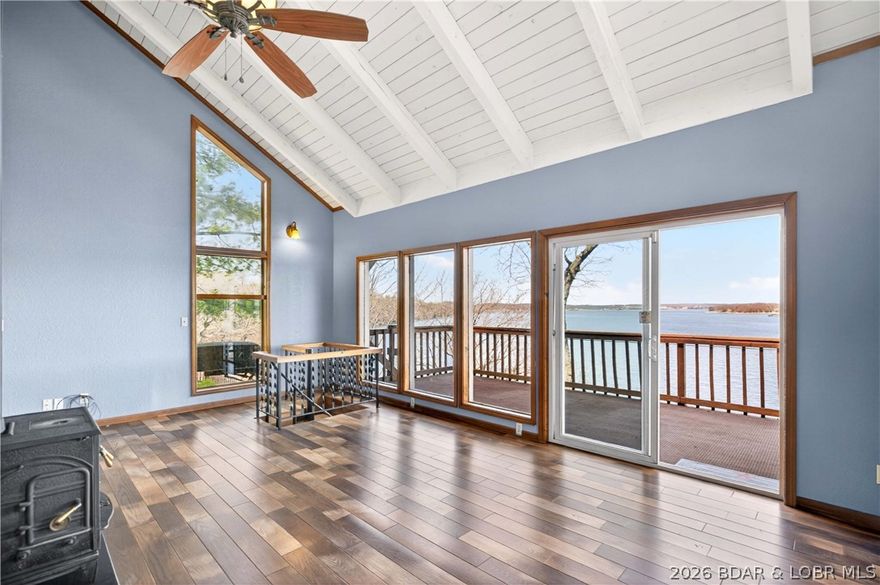 176 Kansas City Way in Sunrise Beach, MO 65079 offers a true Lake of the Ozarks waterfront lifestyle with stunning views and effortless lake access. This 3-bedroom, 3-bath home features approximately 2,056 square feet with a walkout lower level and an inviting layout designed to capture the water from multiple vantage points.

Wake up to sunrise views over the lake and enjoy them year-round through large windows that fill the home with natural light. The main living area features a cozy wood-burning stove, while the walk-in level includes a spacious primary suite, additional bedrooms are located on lower levels for guests or family.

Outdoor living shines with multiple decks, a hot tub overlooking the water, and a private tram that takes you directly to the shoreline. The property includes a swim dock and is permitted for a larger dock setup.

Located just minutes from Highway 5, this home offers convenient access to Sunrise Beach shopping, dining, and lake attractions. With rentals allowed, it also offers excellent potential as a vacation home, investment property, or full-time residence.