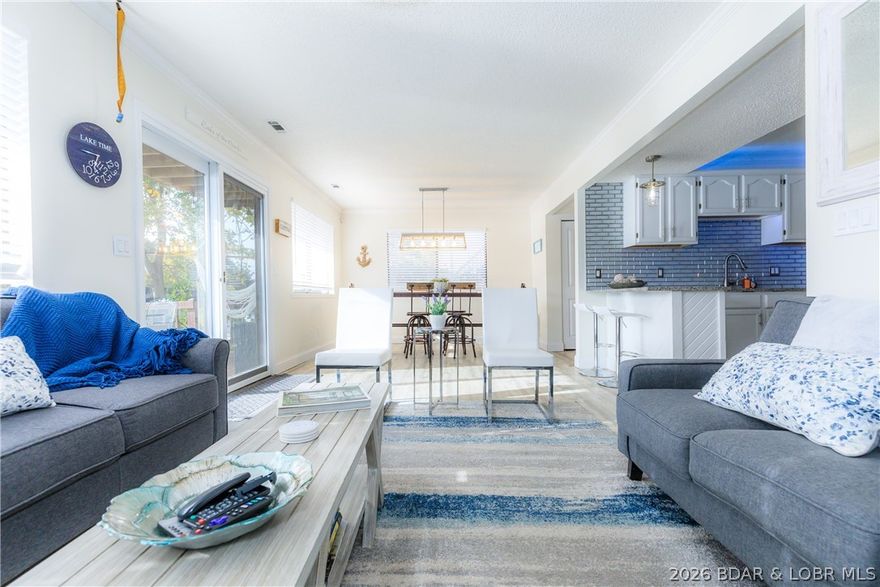 This stunningly remodeled lakefront home in Camdenton, Missouri, features 3 bedrooms, 3 bathrooms, and 69 feet of prime lake frontage at the 1 Mile Marker of the Big Niangua Arm. Thoughtfully updated from top to bottom, the home showcases modern finishes, updated fixtures, and new flooring throughout. The open-concept living spaces are designed to maximize lake views and natural light, creating a bright and inviting atmosphere—step outside to enjoy expansive decks ideal for both relaxing and entertaining while taking in the waterfront setting. The property includes two boat slips—a 16x40 and a 10x28— offering excellent access for boating, fishing, and swimming. With ample space to expand or enjoy added privacy, this move-in-ready home presents a rare opportunity to own a beautifully updated lakefront retreat in one of the most desirable areas of the Lake of the Ozarks.