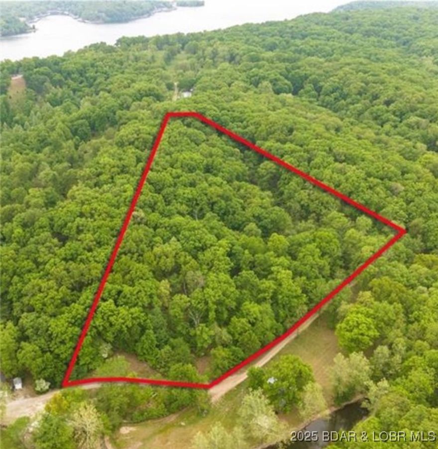 Great Opportunity to build a second tier home with beautiful views of Lake of the Ozarks! This 6.7 acre property leaves room for a beautiful home, workshop, green house, guest house, and still have trails for recreational purposes. Come see if this is the one for you.