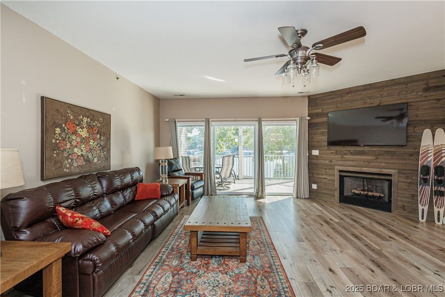 Stunning waterfront view in this FULL PACKAGE updated, fully furnished, 3 bed, 2 bath unit boasting a GARAGE, 12x30 boat slip W/ LIFT, & 2 Jet Ski slips w/ LIFTS! All slips are visible right in front of the unit-only 13 steps to the dock located on a large cove on the 13MM. Relax and take in the eastern exposure sunrise with incredible water view on the large screened balcony or cozy up in front of the gas fireplace w/ expansive 9' ceilings. Heated salt water pool, new luxury plank flooring, master walk in tiled shower, new water heater, patio storage, master walk in closet, dual vanity sinks, Jack & Jill door from 2nd bedroom to guest bath, kitchen walk in pantry, & open floor plan, & elevator in the next building for loads from parking to dock level. Convenient location just over the bridge (No Toll any longer!) minutes to shopping, entertainment, golf, dining, & all of the lake fun. Full time maintenance on sight and extremely well maintained complex. Garage has pull down attic storage and you can park your trailer or overflow parking there for the weekend. Peaceful non-rental complex (family and friends welcome) so you can truly come relax and enjoy your lake piece of paradise!