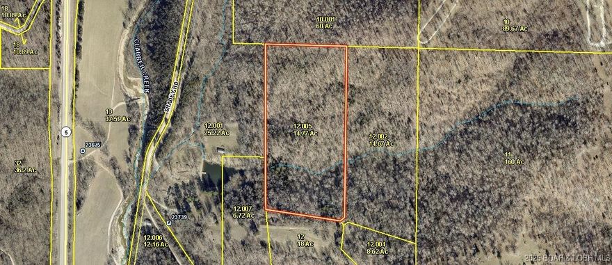 Looking for secluded acreage for hunting? camping? building a home, or simply getting away to a quiet place in the woods?  Come see this 14,77 acres in Gravois Mills where you can do all of the above without being disturbed. This wooded tract of land offers mature trees, moderate terrain, and an excellent place to camp, hunt, build a cabin or full-time home. For those who like to get away to their own private place, but do not want to have to be miles away from civilization, this tract is quietly tucked away into nature's haven, but only minutes from the cities of Gravois Mills, Versailles and Laurie where you will find groceries, shops, medical services recreation, etc. Just a short drive off MO Hwy. 5, south of Versailles. Come take a look today!