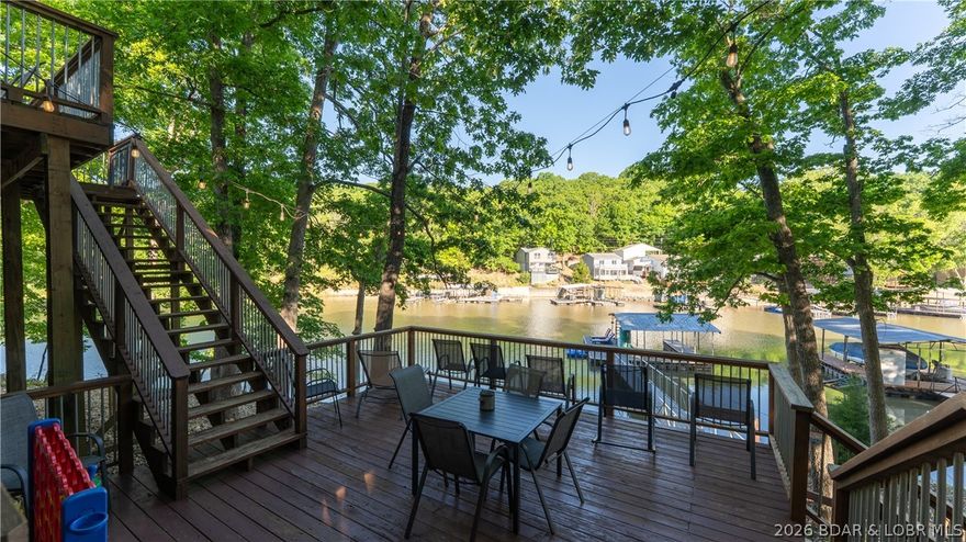 Experience the best of Lake of the Ozarks living with this exceptional property in the heart of Osage Beach! Currently operating as a successful vacation rental, this home also offers everything needed for a fantastic full-time lake retreat. Tucked away at the end of Yacht Club Drive in a peaceful cove, you’ll enjoy a rare blend of privacy while still being just minutes from the dining, shopping, entertainment, and waterfront fun that make this one of the lake’s most desirable locations. The gently sloping lot adds to the property’s appeal with easy access and usability. Inside, the home features two primary suites, including one added in a recent remodel, making the layout ideal for hosting family and guests. Stylish updates include granite countertops, stainless steel appliances, and modern fixtures throughout. Major improvements include a new septic system, HVAC, and water heater for added peace of mind. Properties offering this mix of location, privacy, and versatility are hard to find—schedule your showing and see what makes this one so special.