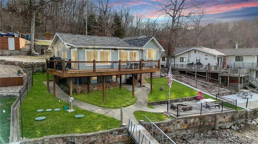 Introducing 3365 Adkins Road located on the 49MM with cove protection, deep water and blacktop roads right to your front door setting the stage for effortless lake living. You will fall in love with the open layout, the large lakeside windows, the primary suite oasis, amazing concrete dock and all the big ticket items that have been updated including roof and septic. The home features a large primary suite with vaulted ceilings, walk in closet and En-suite bathroom. The living room is spacious and filled with natural light along with amazing views. The updated kitchen features stainless steel appliances, plenty of counter space and a kitchen island perfect for entertaining. The large deck is the perfect spot for a morning coffee or grilling this summer looking over the wide cove. The finished basement includes an additional bedroom and full bath perfect for a bunk room or additional rec area. There is plenty of parking space on the concrete driveway and room to build a garage or add additional parking at the top of the driveway. The concrete dock features a 14x38 and 11x30 boat slips, 2 covered PWC slips, swim platform and covered seating area. Just in Time for Lake Season!