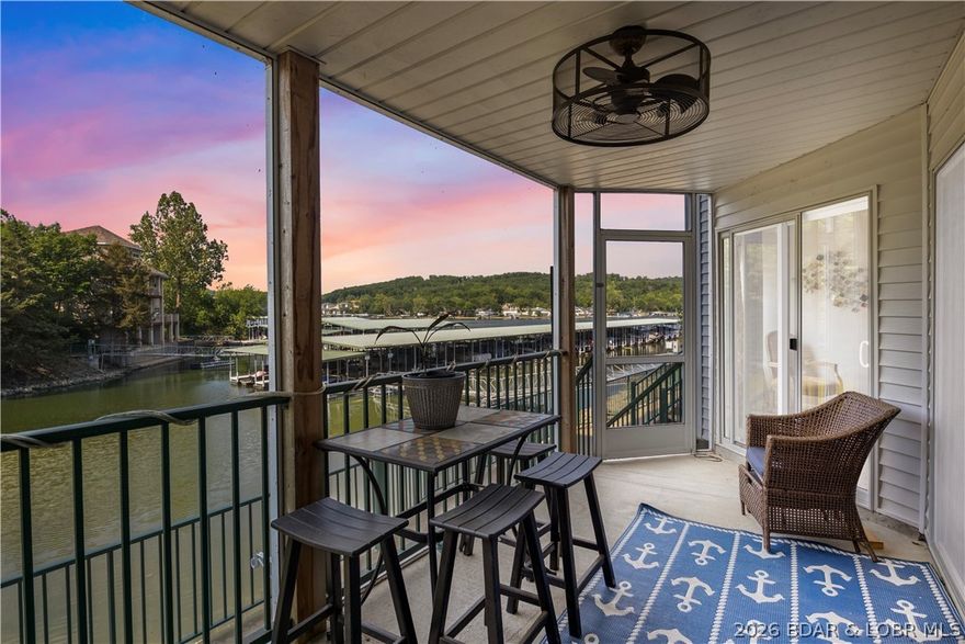 Turnkey waterfront condo positioned as both a strong income-producing vacation rental and a personal Lake of the Ozarks retreat. This 3-bedroom, 3-bath condo features a spacious two-story layout with multiple living areas, ideal for entertaining and extended stays. The lower level includes a large walk-in closet currently utilized as a fourth sleeping space for Airbnb, allowing the property to function as a 4-bedroom short-term rental, which enhances nightly pricing and occupancy potential. The open-concept main level offers a fully equipped kitchen, dining area, and living room, while the lower level provides additional gathering space, a wet bar, and walk-out access. Located in the desirable Cedar Heights community, owners and guests enjoy two resort-style pools and beautiful waterfront surroundings. Currently operating as a successful short-term rental, this property offers immediate income with flexibility for personal use. Convenient to marinas, dining, shopping, and lake attractions, this is a rare opportunity to own a versatile, rental-ready condo with proven performance upside. Includes 12x32 boat slip with 10,000 lb lift.