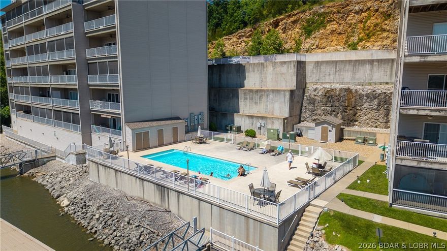 Get yourself a great vacation retreat at Lake of the Ozarks! Welcome to 138 Oak Harbor 5C!  Take the elevator to the fifth floor and walk into to serenity at the lake. A primary suite that makes you want to linger a while and two guest bedrooms to delight your guests.  This kitchen is ready to go with updated counters and appliances.  Lochhaven is an intimate setting with just two buildings so there's no overcrowded weekends here.  In a protected cove, parking your boat is a breeze. Just minutes to Camdenton and great lake hot spots like the Fish & Co. and Larry's on the Lake and Nauti Fish Rum Bar and Captain Ron's.  Let's make this your new HAPPY PLACE at the lake! CALL YOUR REAL ESTATE PROFESSIONAL TODAY>