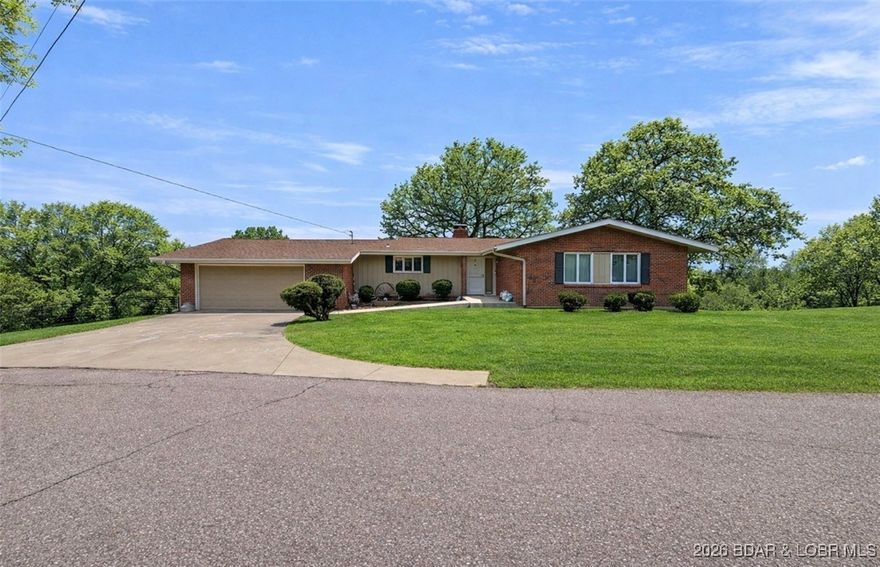 Nestled in a quiet cul-de-sac within city limits, this cozy 4-bedroom, 3 bath home is located in a sought-after neighborhood and offers peaceful living with a scenic lake view. Set on 2.5 acres, the property provides a rare blend of privacy and convenience, just minutes from town. While the home is slightly dated, it is well maintained and full of character, offering a comfortable layout ideal for family living. The expansive acreage presents unlimited possibilities, including space for a workshop, hobby area, or future expansion. Located in a family friendly neighborhood, this property delivers the tranquility of country style living, with the ease of nearby city amenities.