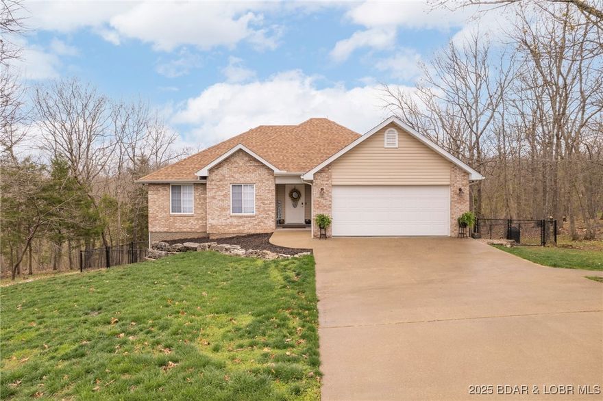 Centered on three lots (over half an acre) and backing up to Four Seasons green space, you’ll love this home’s quiet setting! It feels like your own hidden retreat, yet you're only minutes from shops, restaurants, and the Lakes main attractions. On the main level, you’ll find a welcoming open layout: kitchen, dining, and living areas flow to a spacious deck perfect for barbecues, relaxing, or catching some sun. There are three bedrooms on the main level (including a primary en suite), plus a full guest bath and laundry. Downstairs, the lower level adds flexibility and extra space: a large cozy living area, a walk-out covered patio, a bedroom, guest bath, utility/storage room and a cedar-lined non-conforming space that’s currently being used as a home office (great for work, hobbies, or extra storage). Recent updates include new decking and stainless appliances. The backyard is fully fenced with a double-gate entrance and two more gates for easy access. To sweeten the deal, the sellers are offering $5,000 credit toward refinishing the hardwood floors. Check out all of the incredible amenities Four Seasons offers at fourseasonspoa.com, pools, parks, lake access, and more!