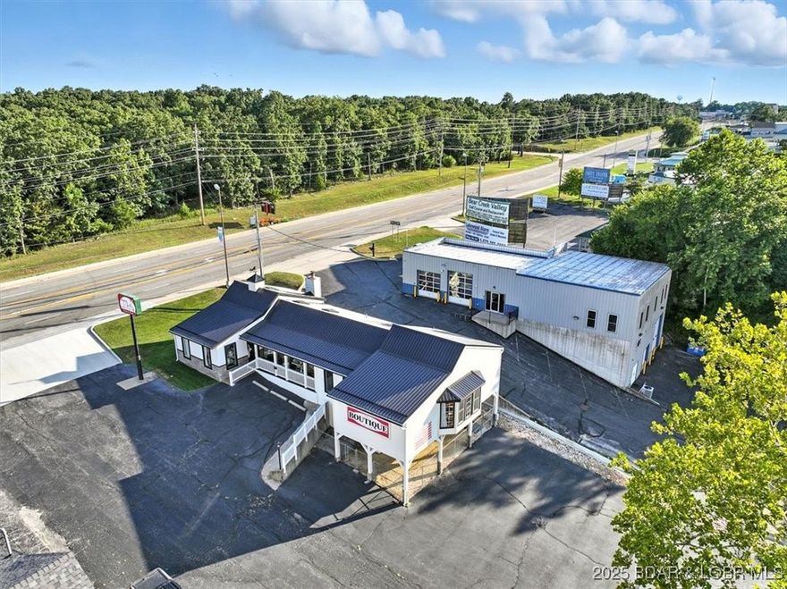 Unlock the potential of this exceptional 4,477 square foot retail space boasting 100 feet of direct highway frontage for maximum visibility and traffic. Strategically located just one exit away from the highly anticipated Oasis Amusement Park and the new Marriott Hotel, this property is perfectly positioned to capitalize on booming tourism and local growth. Versatile zoning allows for a variety of uses including a retail storefront, gourmet specialty shop, luxury spa, or boutique experience. Whether you're launching a new concept or expanding an established brand, this location offers unmatched exposure and accessibility. Don’t miss your chance to be part of Osage Beach’s exciting future!