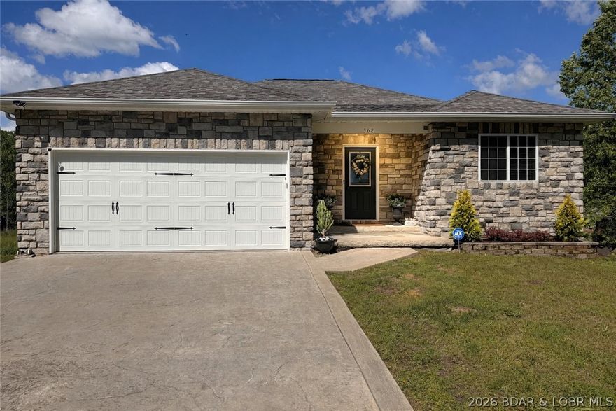 Fresh, modern updates are just being completed on this beautifully refreshed home, featuring 4 bedrooms, 3 full bathrooms, and two separate laundry areas for added convenience. Enjoy comfortable main-level living with an inviting living room, plus a large lower-level family room—perfect for entertaining or relaxing. The home features numerous upgrades throughout, including brand-new luxury vinyl flooring on the upper level. The walkout basement expands your living space with a 4th bedroom or office, a full bathroom, a wet bar, and a generous recreation area in addition to the oversized family room. The fully fenced yard is beautifully designed with rock landscaping, pavers, and mature greenery, creating a low-maintenance oasis. Enjoy outdoor living on the upper deck with stairs leading down to a massive newly built deck (2024). The hot tub that can be included (negotiable), along with a separate dog run to keep every member of the household happy. Camelot Estates offers an impressive lineup of amenities, including a boat ramp, two community pools, clubhouse, tennis courts, fishing docks, and available boat slips for rent, and more! Two additional neighboring lots can be purchased!