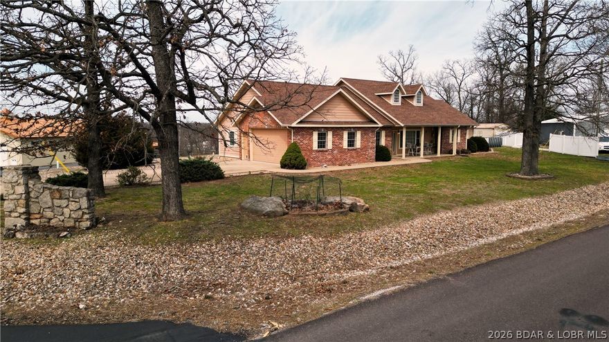 Nestled on a picturesque 1-acre lot, this beautiful brick home offers the rare luxury of stunning lake views on both sides—sunrise coffee, sunset serenity. A nearby boat ramp just down the hill makes lake days effortless, whether you're chasing early morning fishing or evening cruises. The property is primed for both relaxation and self-sufficiency with homesteaders in mind, featuring established raised garden beds ready for your summer harvest, a chicken house for fresh eggs, and an above-ground pool perfect for cooling off on warm Missouri days. The attached workshop is equipped with mini split for heating and cooling when needed.   With ample space to build a shop, expand, or simply enjoy the open surroundings, this property blends peaceful country living with everyday convenience and all in a fabulous location. Whether you're looking for a full-time residence or a weekend escape, this one delivers the kind of Lifestyle people dream about.