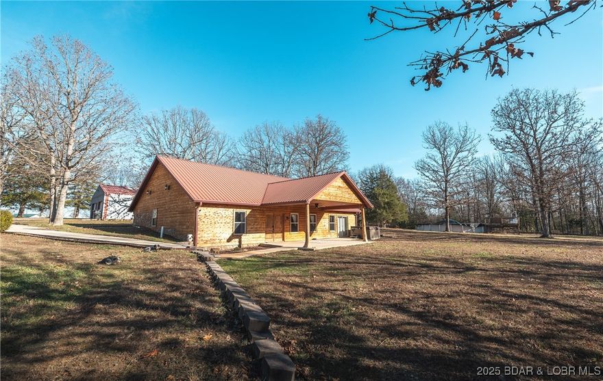 Located in Pulaski County, MO this charming 3-bedroom, 2-bathroom home offering over 2,200 sq ft of comfortable living space. Wrapped in wood siding for a classic log-cabin feel, this property sits on approximately 8 m/l acres of mostly wooded land—perfect for anyone who loves privacy, nature, and room to roam. A pond adds to the beauty of the setting, while an above-ground pool offers a great spot to cool off during warm Missouri summers. The property also features a 2-bay detached shop, ideal for storage, parking, or your favorite hobbies. Located in the Laquey School District, this home provides a blend of country living and convenience. Approximately 20 minutes from Ft. Leonard Wood and joins National Forest for great deer and turkey hunting.
