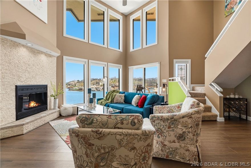 Welcome to this beautifully appointed 2-level, 3-bedroom, 3-bath condo offering breathtaking main channel views from the moment you walk in. Floor-to-ceiling windows perfectly frame the lake, filling the space with natural light, while professional tinting enhances energy efficiency without compromising the view. All lake-facing windows and three slider doors feature custom blinds, with select blinds battery operated for added convenience and a modern touch. This property is being sold fully furnished, making it truly move-in ready. Enjoy the lake lifestyle with a 12x40 boat slip and an additional PWC slip, both ideally located beyond the no-wake buoy for calm, protected water year-round. Located in The Breakers, a highly desirable community known for its quiet setting and no-rental policy, this condo offers peace and privacy. Amenities include a pool, clubhouse, and tennis courts. Convenient location by land or water with unforgettable views.