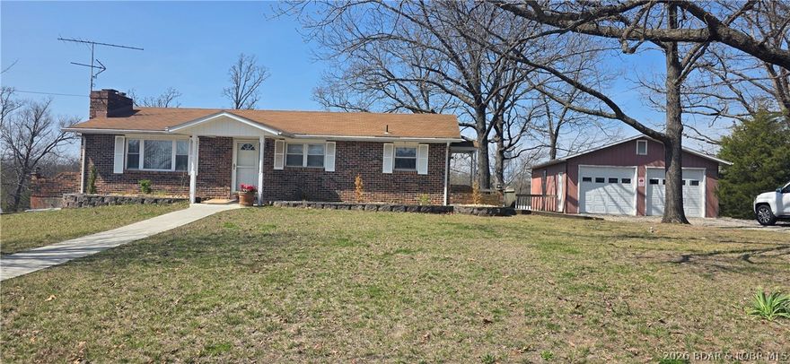 Great Location in the heart of Laurie with this 2 bedroom 2 bath brick home on a large flat lot.  Oversized detached garage with lots of parking, fire pit in back yard.  Full unfinished basement with unlimited possibilities.  With some updating you could make this a very beautiful home.