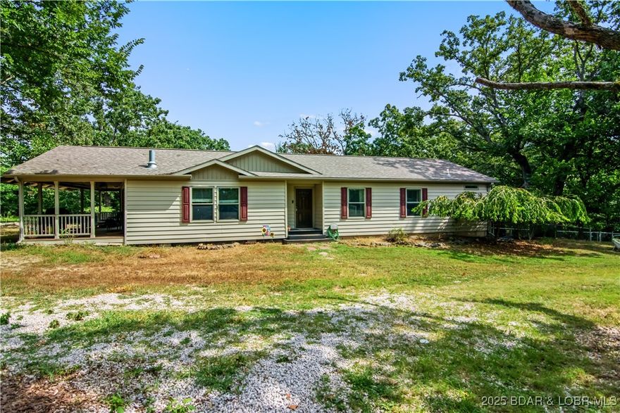 Private home hidden peacefully in the woods but only a short driveway approach from the popular Hwy O.  This 3 bedroom, 2 bath home sits on nearly 4 gentle acres, has two small ponds, raised flower beds, a fenced back yard, spectacular wildlife and beautiful trees!  This 2018 Commodore Home of Indiana is a well constructed modular home sitting on a foundation with a very clean and dry crawlspace.  Plenty of room to keep your toys, target practice, build a shop and just enjoy outdoors.  The owners have even had chickens in the past!  The interior of the home is very nice with quality laminate flooring, soft close cabinets, stainless appliances and even a tile backsplash.  The spacious living room features two double sliding doors that lead out to the perfect covered porch and serene back yard!