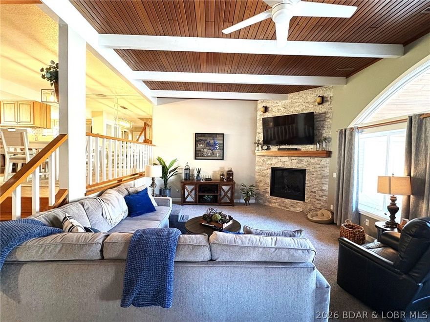 Imagine living in the gated community of Lake Point where there are only 20 townhome style units that seem more like private homes than condos w/no one above or below you. The beautiful drive in leads to a cove located quiet complex w/lush landscaping & unit #25. Step inside to the main floor w/beautiful tile floors, a kitchen that is well equipped with quality cabinetry, granite countertops & Frigidaire Professional line appliances, a spacious dining area, laundry & a newly remodeled full bath. Down just a few steps is an oversized family room w/gorgeous beamed wood ceilings, a wall of arched windows & a (rare) gas fireplace, along w/ a trendy wet bar ready to entertain. Step outside to the covered veranda w/arched wood ceilings offering a large space for outdoor entertaining & 2 storage areas. Your 12 x 30 boat slip & pwc space are just steps away & right in view from your unit. Upstairs offers 3 bedrooms & 2 baths. The master bedroom is roomy with cedar lined closets & adjoining bath w/ dual sinks & a shower w/jetted tub. The 2 large guest bedrooms & bath w/walk in shower are sure to please any friends & family. Amenities incl. a pool, tennis/pickleball courts and NO RENTALS!