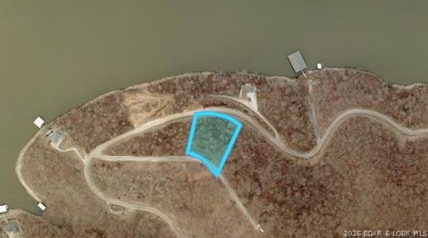 Discover the opportunity to build your Lake of the Ozarks getaway on Lot 74 Eagle Bay Drive in Gravois Mills. This 1.73-acre lot offers a peaceful setting with seasonal lake views and room to create the kind of retreat you’ve been dreaming about. Located in the Eagle Bay subdivision, owners enjoy community amenities including boat ramp access, boat trailer parking, road maintenance, community water, central sewer, and dock access for enjoying life on the water. With blacktop road access and a desirable location near the lake, this property is ready for your vision. Yearly HOA fees are $250.