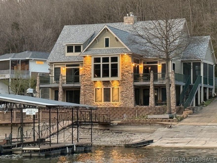 This property has everything that is sought after in a lake home. First time on the market since the owner rebuilt. Lets start with a very short drive off of Hwy 5, asphalt to the door, 2 car garage, one level living possible, private boat ramp, 4 bedrooms with 4 full bathrooms, awesome lake views from almost everywhere, cove protected, 2 well dock with lifts and swim platform, desert landscape, garden area, large deck out over the seawall, greenhouse, beautiful living room, plenty of parking and so much more. It's also in a  great 10 house subdivision! Take a look at the pictures but don't let this one slip by.