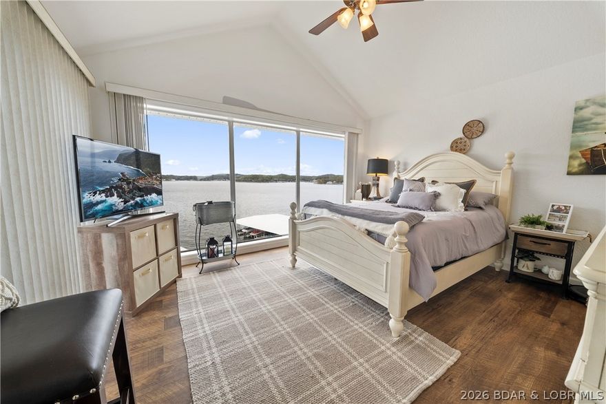 SELLER OFFERING $5,000 CREDIT! Experience lake life in style with this turn-key 2 bed, 2 bath top-floor condo at Windsor Bay Condominiums on the beautiful Lake of the Ozarks. This stunning unit features vaulted ceilings, tasteful modern updates, and west-facing views that deliver unforgettable sunsets every evening. The open-concept living area flows seamlessly to a private lakeside deck, creating the perfect space for entertaining or simply relaxing while taking in the serene views. Sold fully furnished, this condo is move-in ready—every detail has been thoughtfully curated for comfort and style. Enjoy the ease of lakefront living with a 12x28 boat slip, New in 2023 Boat Lift with Captains Choice, and a PWC slip & PWC Lift with Captains Choice included, giving you instant access to endless days on the water. Whether you’re seeking a weekend getaway, or full-time residence, this top-floor retreat offers the perfect blend of sophistication, convenience, and lakefront charm. Don’t miss your chance to own a piece of the Windsor Bay lifestyle—where every day feels like a getaway at the Lake of the Ozarks.