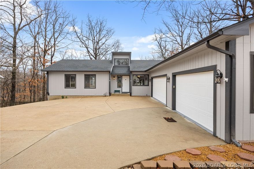 Experience Lake Ozark living in the Village of Four Seasons. Motivated Sellers! This meticulously updated, move-in-ready gem spans 5+ bedrooms & 3 baths, offering a rare layout designed for multi-generational living, dual-family ownership, or a high-yield investment. Renovated top to bottom, the interior shines with new tile entry, plush carpet, LED fixtures, ceiling fans, French doors & interior doors. The chef’s kitchen boasts quartz countertops, tile backsplash, & new appliances. Retreat to the primary suite featuring a spa-like bath with a new quartz vanity. Convenience is key with a dedicated main-level laundry room complete with cabinetry & sink. Versatile Lower Level & ADU Potential as the walk-out lower level serves as true 2nd living quarters, featuring wood-plank laminate flooring, living room with gas fireplace, full kitchen, 2 BR, bonus room, & a 2nd laundry. Key features: 3-car heated garage + parking for 9 vehicles; Safe room (plumbed); 8 total appliances: 2 Refrigerators, 2 Dishwashers, 2 Stoves, 1 Washer, 1 Dryer; Water Softener-Owned; new water heater; 2-year-old roof, gutters, & fresh paint/trim.  Don't miss this one-of-a-kind, turn-key masterpiece!