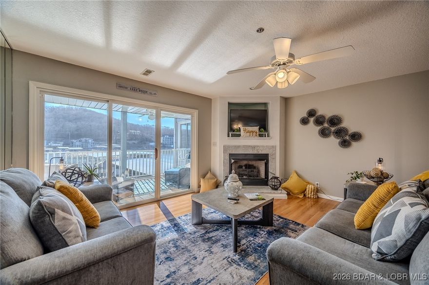 In Camdenton & Greenview Areas @ 5 Mile Marker of the Big Niangua Arm of the Lake of the Ozarks, just Waiting for You to Arrive & See for Yourself this Clean/Well Maintained & Cute-Cute-Cute 2Bd/ 2Bath, 1,150 SqFt Lake Front Condo in Vision Condominiums! Turnkey Purchase (But Many Decorative Items are Staged Items). Includes Dock A, Slip 10 & a 12x30 Boat Slip w/ 6000#/8000# Lift. Corner Gas Fireplace, Screened-in Lake Front Deck w/ BBQ Area, Laundry Rm, Newer SS Appliances, Lrg Master Suite, Lots of Park’g. Several Upgrades in 2024-2025. Substantial Funds in Reserves. It is NOT OFTEN that a Condo in this Self-Managed Condo Complex Come Up for Sale. Large Lk Frt Pool Area w/ Bathroom & Dock are just <1 minute from your door in. Deep Water Protected Cove w/ Lovely Main Channel Views in one of the Quieter Parts of The Lake. YES you can swim off of the Docks. 5-10 Minutes to Town, Shopping, Schools. Just 5-10 minutes by Boat or Car to Water Front Fun Venues. Great Area for Fish’g, Ski’g, Wakeboarding, Boat’g most days of the week. Reasonable HOA Fees. No RENTAL. Landscaped Waterfront Boardwalk. PWC Slips May be Available from Other Owners. B SURE to ask to see the EXTRA FEATURE SHEET