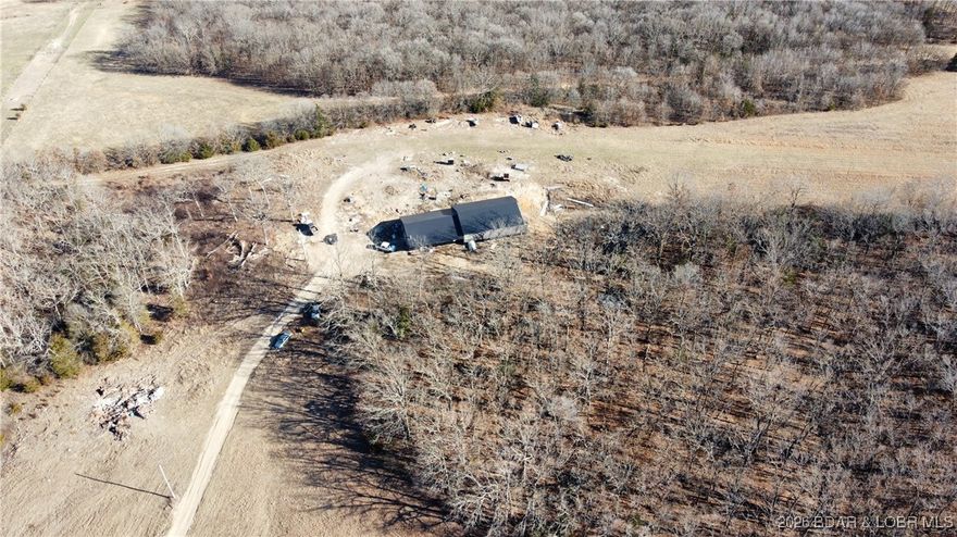 Private 25± acre property featuring a nearly new home built in 2022. This 3-bedroom, 2.5 bath residence offers metal siding and a metal roof for low-maintenance durability as well as SIP walls providing a strong base and R26 insulation to keep the home well heated and cooled. The home features a spacious open-concept kitchen and living area with excellent natural light and functional flow, along with two 6’ x 50’ porches on each side of the home—ideal for enjoying the peaceful surroundings. Finish this home to your exact taste, the heavy lifting is already done! The land is well suited for recreation, hunting, and outdoor enjoyment. Accessed by a private drive, the property provides a quiet and secluded setting. Also included is a 60’ x 50’ shop with plumbing in place for a future apartment and plumbed for heated floors, offering excellent versatility for storage, workspace, or expansion. An excellent option for those seeking privacy, recreational acreage, and a well-built modern home in a rural setting.