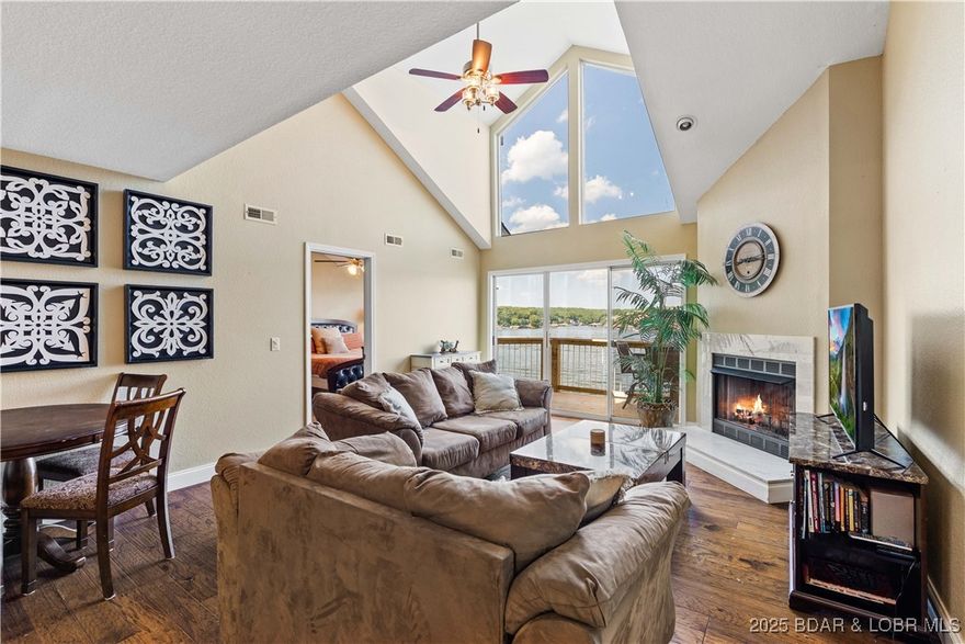 Top-Floor Ledges Condo w/ unobstructed & panoramic main channel views is TURN KEY investment w/proven rental history packaged w/ 14x40 boat slip & PWC slip. Updated top-floor unit in Bldg 9 offers vaulted ceilings, brand new deck & square footage comparable to a house for guests to spread out & enjoy. Expansive wall of windows flood space w/ natural light while cozied up to corner fireplace for year round enjoyment. Inlaid tiled flooring enhances entry way & kitchen. Primary suite offers views from bed, walk in closet, double vanity sink & private access door to deck. Massive, loft-style 3rd bed can comfortably accommodate 2 or more king-sized beds, bunks, add'l living room furniture or can be walled to make more sleeping space & room for an add'l bathroom making it an ideal space for guests & family.  Complex offers resort-style amenities such as 2 pools, swimming beach in the heart of Osage Beach on 21 mm w/ quick access to restaurants by land or water, shopping, healthcare & highways for commuters. Contact HOA for list of garages available to purchase outside of sale. Have guests or renters lined up on day of closing to enjoy the lake life at beautiful Lake of the Ozarks!