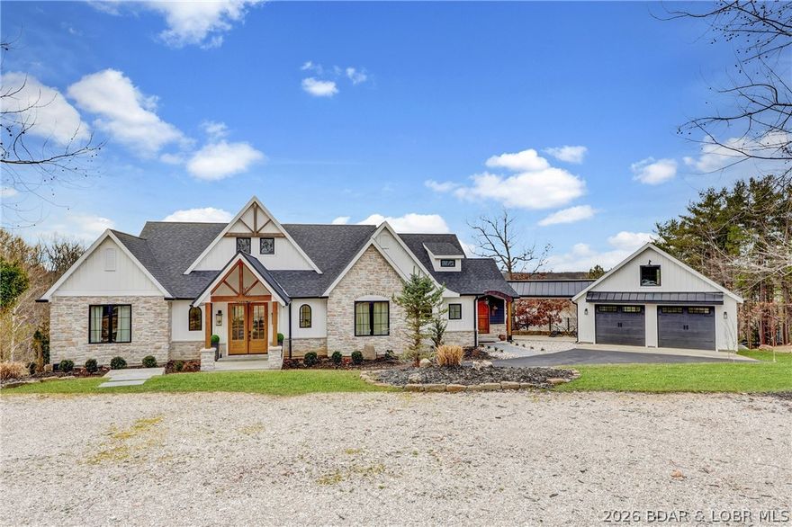 Experience the perfect blend of luxury, comfort & nature in this newly custom-built waterfront retreat. Designed w/ 6 bdrms & 4.5 bths, this home showcases exceptional craftsmanship & upscale finishes throughout. A stunning wall of windows captures beautiful lake views & fills the home w/ natural light. Elegant arched doorways add architectural charm & timeless character, custom cabinetry & detailed millwork elevate the overall design. The LL is an entertainer’s dream, complete w/ a full bar —ideal for hosting family & friends. Perfect for game nights, holidays or summer weekends at the lake, this space was made for gatherings. Step outside to enjoy mornings on the screened-in porch, relax on the expansive deck or gather around the lakeside fire pit for evenings under the stars. W/ generous acreage, waterfront access & privacy, this property offers a rare combination of land, luxury & tranquil lake living, located by popular restaurants, golf courses & attractions. A 2-C garage is complemented by extensive driveway space, providing plenty of parking. More than just a home, this is a private waterfront sanctuary w/ views & peaceful surroundings allowing you to truly relax & breathe.