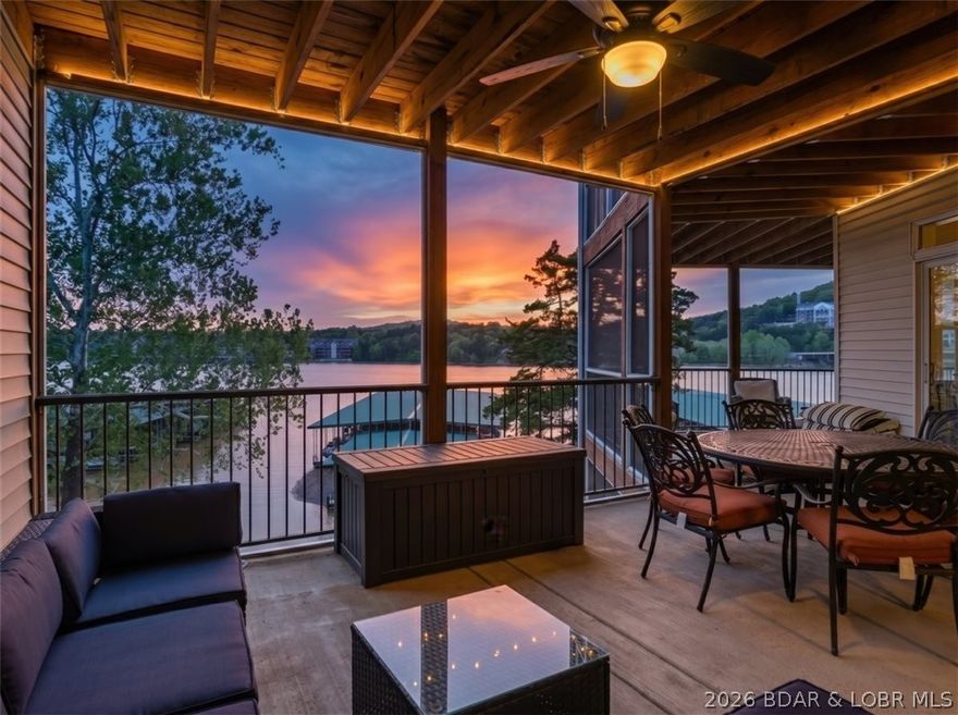 Experience effortless lake living at 55 Cedar Green #3E, this one-of-a-kind 4-bedroom, 3.5-bath lakefront condo in Cedar Green Luxury Condominiums. This thoughtfully designed condo complete with TWO -12x32 boat slips (PWC lift + lift) at Dock 3 and garage blends convenience and function. This open-concept floor plan highlights 9-foot ceilings and Great Room with dual sets of oversized sliding glass doors, seamlessly connecting the spaces to the expansive screened-in deck. The kitchen is both functional and inviting, complete with staggered cabinets, pantry storage, and breakfast bar. The dining area accommodates eight, making hosting effortless. The lakefront primary suite is a private retreat, offering water views and a luxurious bathroom with soaking tub, shower, and dual vanities. Oversized guest bedrooms provide exceptional comfort and space for visitors, while the additional half bath adds convenience and privacy. The showstopper is an oversized screened-in lakefront deck, perfectly positioned for sunset views over the water and lakeside pool. Conveniently located near golf, dining, recreation and shopping, this turn-key property delivers the ultimate lake experience.