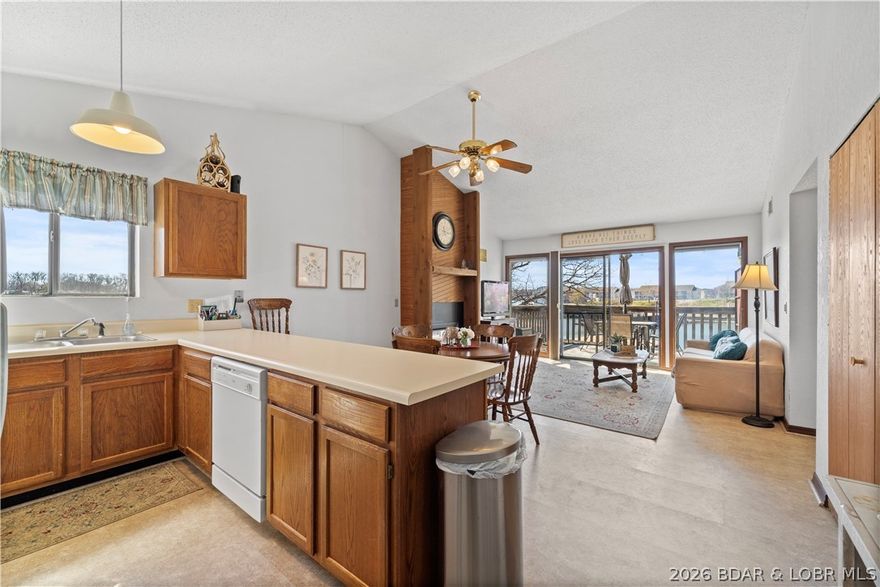 Fantastic find in Southwood Shores Condo Complex! Top floor, waterfront condo that comes turn-key with a boat slip and lift. This is an end unit which gives you better views and an extra window. Vaulted ceilings and open floor plan. Lots of windows make it nice and bright. Easy walk to your dock and close to the pool. This is a gated complex with hot tub, indoor and outdoor pools, clubhouse, tennis and basketball courts, trailer parking, boat ramp, and playground. Would make an excellent nightly rental or keep this one for yourself. Located on the 12 mile marker. New water heater in January 2026.