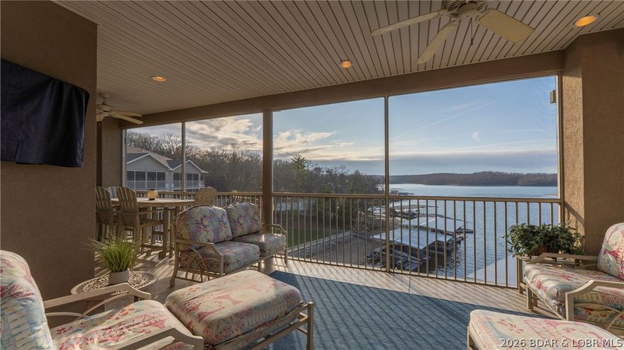 Penthouse Views That Go On for Miles – Welcome to Mystic Bay - 
Wake up to endless sunrises and unwind to glowing main channel views in this top-floor penthouse at Mystic Bay. Perfectly positioned on the Grand Glaize Arm next to the State Park, this gated community offers a rare sense of privacy with no future development—just peaceful lake living at its finest.
This developer’s custom penthouse sits just steps from the elevator for easy access to the pool and docks below. Inside, you’ll find 9’ ceilings, a soaring cathedral ceiling in the main living area, 8’ doors, and upscale finishes throughout—cove molding with accent lighting, granite countertops, and under/over cabinet lighting.
Designed to impress, the open layout flows effortlessly to a spacious screened balcony plus a separate grilling deck, both overlooking the pool, docks and Lake. Every bedroom features its own en-suite bath, plus a convenient half bath for guests.
Complete with a 16x40 boat slip with 14,000 lb lift, two PWC slips with lifts, oversized garage with loft storage, and recent upgrades including HVAC (2025) and appliances (2024/2025). Opportunities like this are rare—schedule your private showing today.