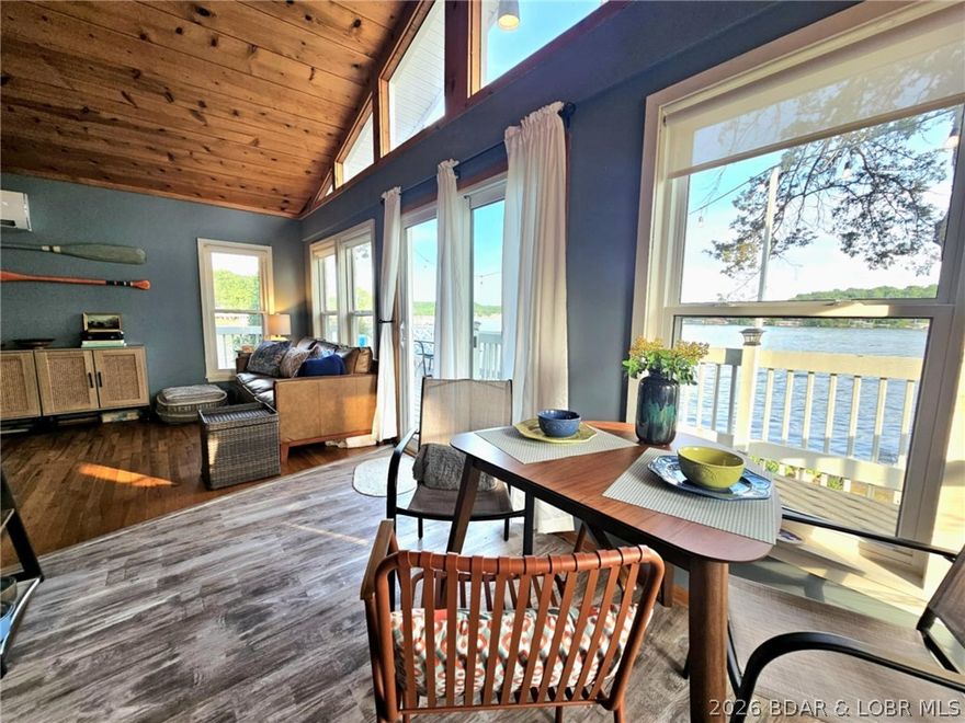 WOWZA! Feast your eyes on the jaw-dropping views from the 5MM of the Gravois Arm! Imagine catching those epic sunsets from your deck that wraps around part of the house. With 2 spacious bedrooms and 1 full bath, this lakefront gem screams cozy, cute, and charming! Whether you're hunting for a vacation escape, a full-time nest, or a savvy investment, this place checks all the boxes. No pesky HOA here—just a tiny yearly fee to keep the road in tip-top shape. Fresh upgrades include a new roof, ductless mini-splits for heating and cooling, and a tankless water heater. DON'T MISS OUT—COME SEE IT FOR YOURSELF!