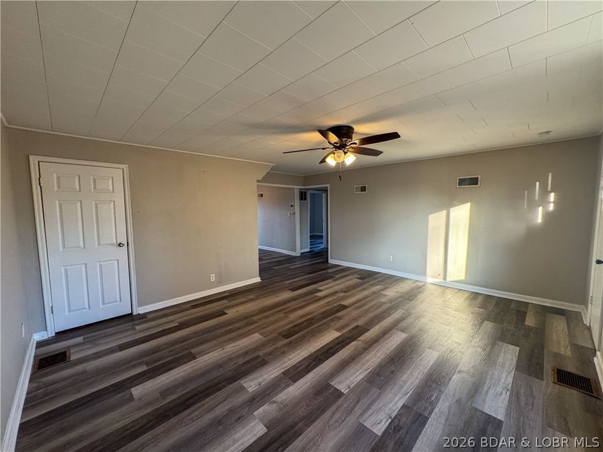 Welcome to this beautiful 3-bedroom, 2-bathroom home offering comfort, space, and an unbeatable location! Step inside to a large, inviting living room filled with natural light—perfect for relaxing evenings or entertaining guests. The open and functional layout flows seamlessly into the dining area and kitchen, creating a warm and welcoming atmosphere for everyday living.
The main level has 2 bedrooms which could also be used for office space, if needed, while upstairs has a bedroom as well as a full bathroom.  Outside, you’ll love the spacious backyard—ideal for outdoor gatherings, concrete area for your BQ grill, gardening, pets, or simply enjoying your own space. The front yard has a nice little porch area too.  The attached garage adds convenience, extra storage, and easy access to the home.  Situated in a great location, this property offers close proximity to shopping, dining, schools, & the city parks, combining neighborhood charm with everyday convenience for the new owner.  This home truly checks all the boxes: space, location, and comfort. Don’t miss the opportunity to make it yours!  Set up your showing today!