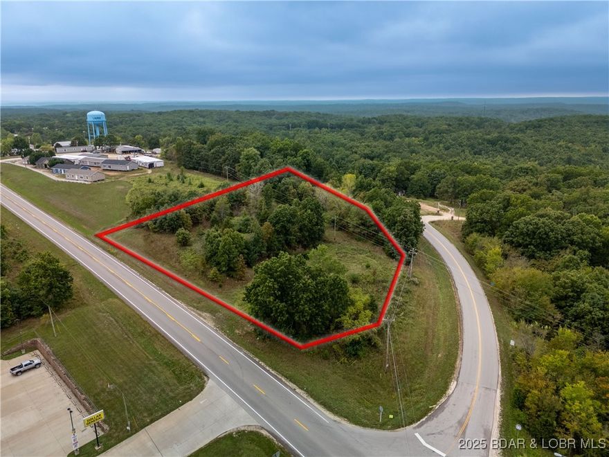 Nearly 2 acres of undeveloped land perfectly positioned on the rapidly growing West Side of beautiful Lake of the Ozarks! Located at the high-visibility junction of Hwy 5 & RA in Laurie, directly across from Dollar General, this property offers excellent traffic counts and exposure for your next business venture. With full-time ownership and population growth surging in this area, property values are on the rise—making now the ideal time to invest. The flat, buildable terrain and prime location make this an exceptional site for a liquor store, gas station, convenience store, or retail center. Whether you’re an investor or entrepreneur, this is your chance to secure a strategic piece of commercial real estate in one of Missouri’s fastest-growing lake communities capturing all the visitors from Kansas City.
