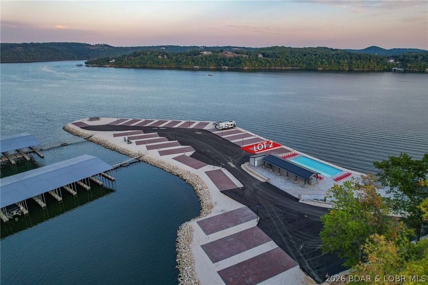 Welcome to Paradise Point RV Resort—one of the most exciting opportunities to own at the 38MM of Lake of the Ozarks. Set on a stunning peninsula with incredible panoramic views, this development offers both lakefront & second-tier RV lots now available for individual purchase. Every site is built right—level concrete pads with full hookups including 100-amp electric, water, sewer, and Wi-Fi—designed for comfort, convenience, & long-term value. An HOA ($200/month) keeps the community maintained and looking sharp. The amenities set this apart: lakefront pool, sandy beach, swimming dock, marina with boat slips available, covered pavilion with grills, large stone fire pits, bathhouse with laundry, and fenced dog park. Whether you want to relax or entertain, it’s all here. Leave your RV on-site year-round and skip the hassle of hauling. When you’re not using it, rent it out for additional income—strong demand makes this a smart investment as well as a lifestyle play. Located in Sunrise Beach with easy access by land and water, this is lake living without the typical price tag or maintenance. Multiple lots available with varying prices—secure your spot now before they’re gone.